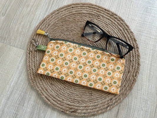 “Green and gold floral eyewear case made with vintage‑inspired Lori Holt Calico Days fabric, with zipper, tassel, and clip.”