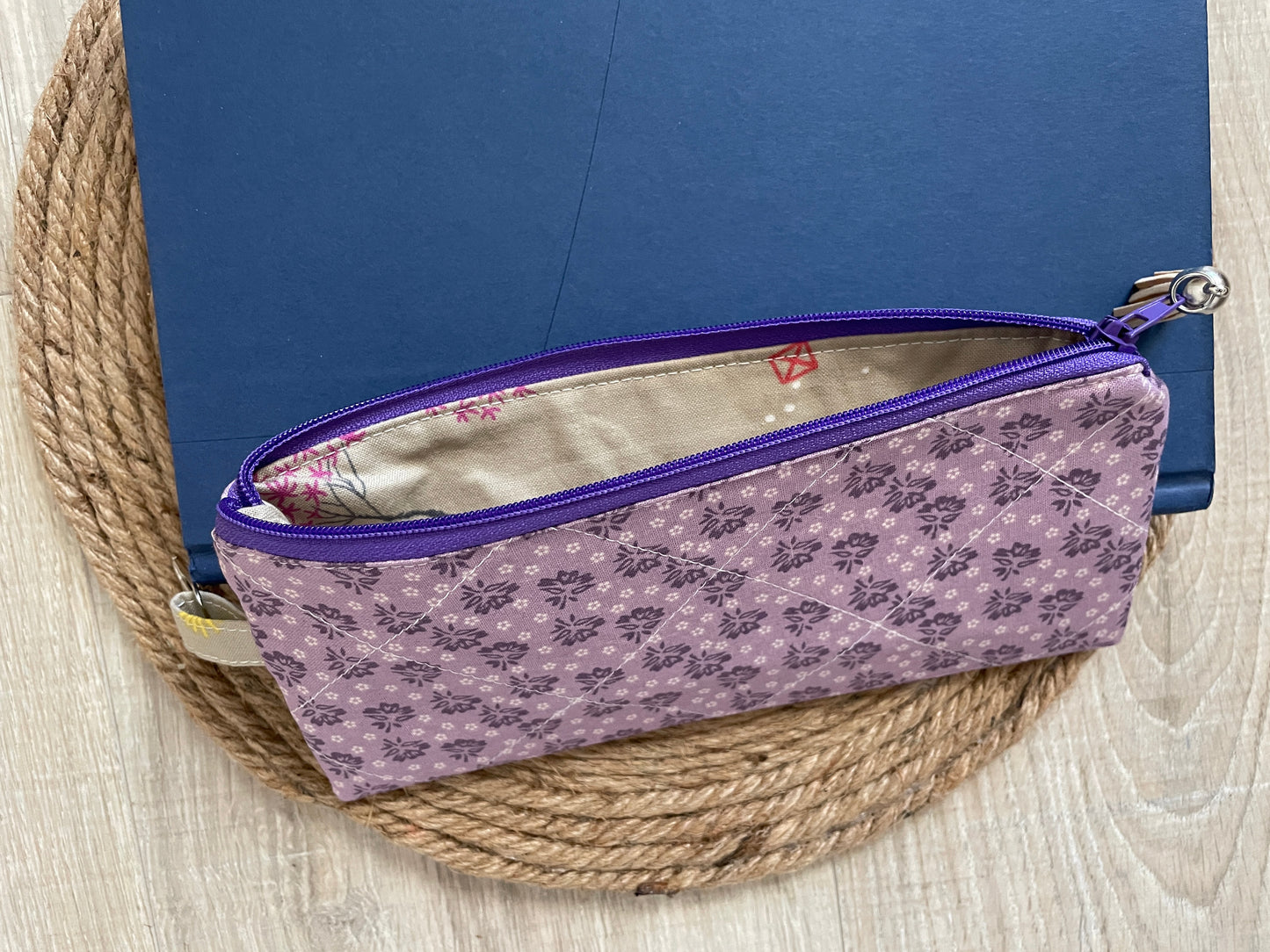 Purple ditzy floral eyewear case made with vintage‑inspired Lori Holt Calico Days fabric.”