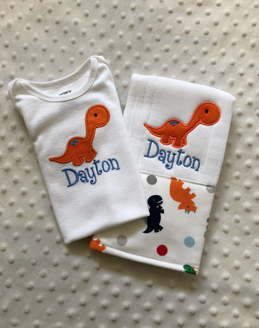 personalized bodysuit and burp cloth dinosaur theme in orange and blue