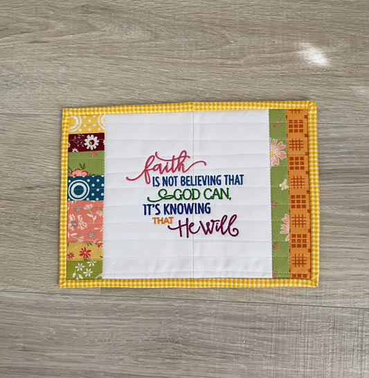 handmade fabric coaster or mug rug with embroidered inspirational Christian text.