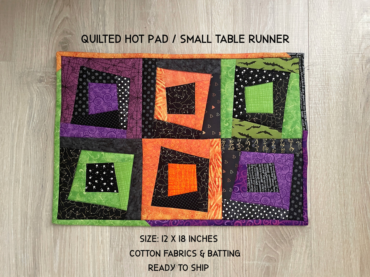 Extra‑large Halloween quilted hot pad with scrappy patchwork in fall colors