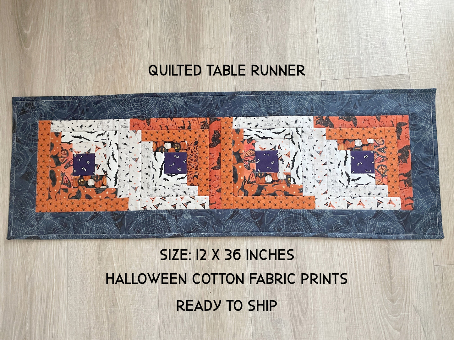 Scrappy Halloween quilted table runner with pumpkins, cats, and witchy prints