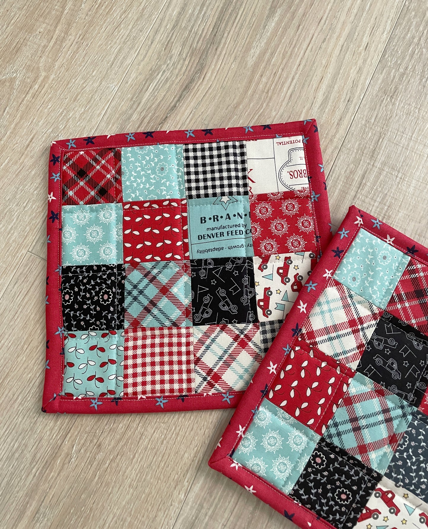 This set of 2 red, white, and blue patchwork potholders / hot pads will be a great addition to your country farmhouse kitchen décor. Each finished hot pad/potholder is generously sized at 8.5 x 8.5 inches.