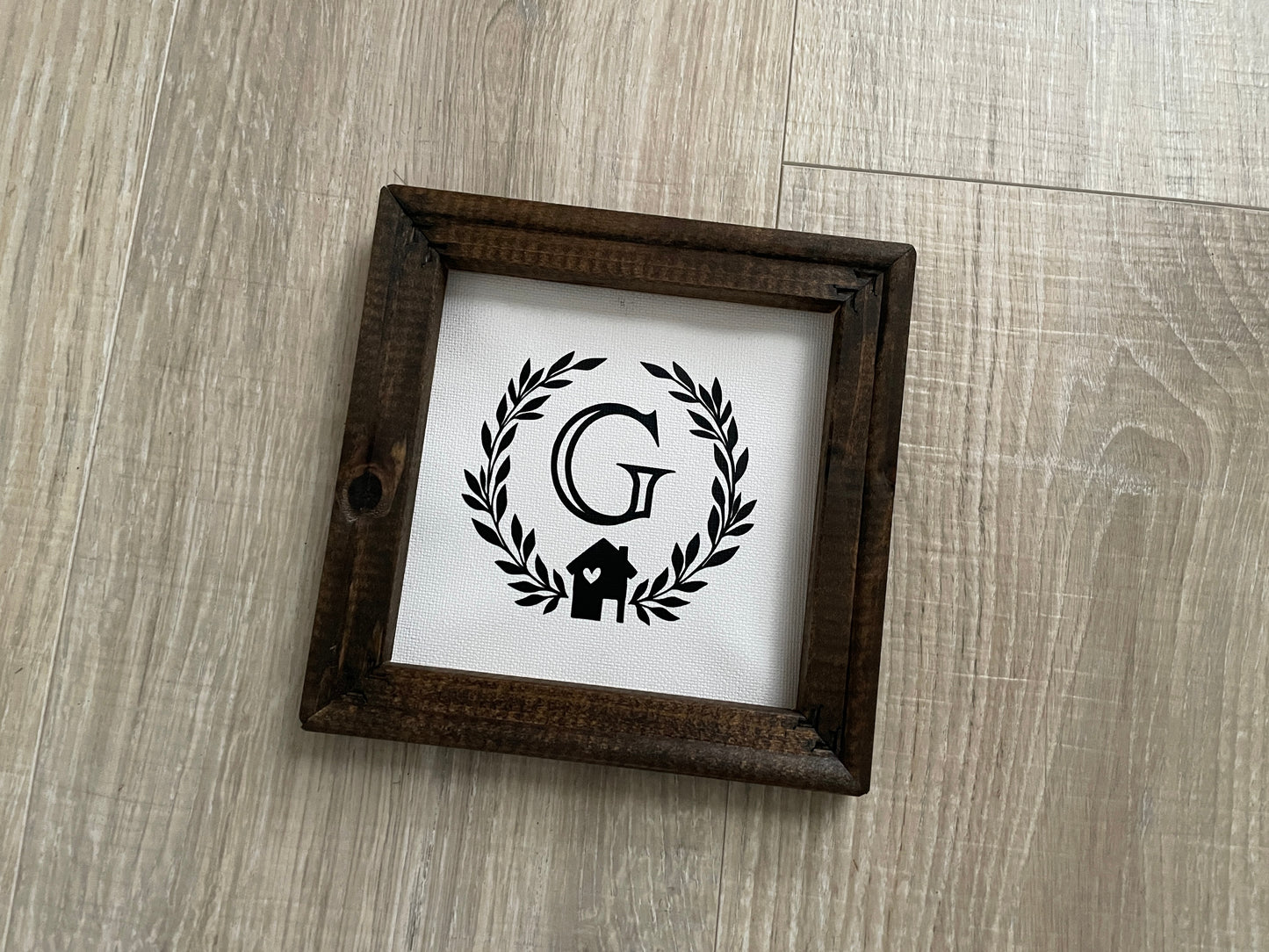 Rustic 6x6 wood framed family initial sign with canvas background and black farmhouse design.