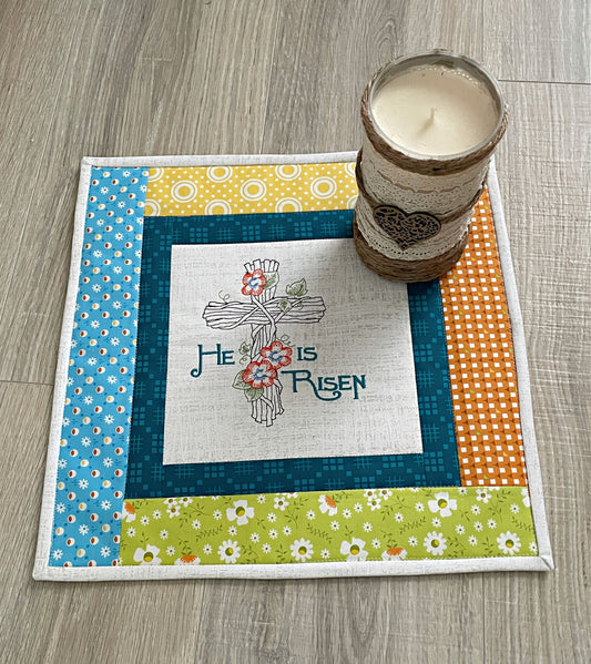 handmade mini quilt for spring with embroidery design He Is Risen in the center panel
