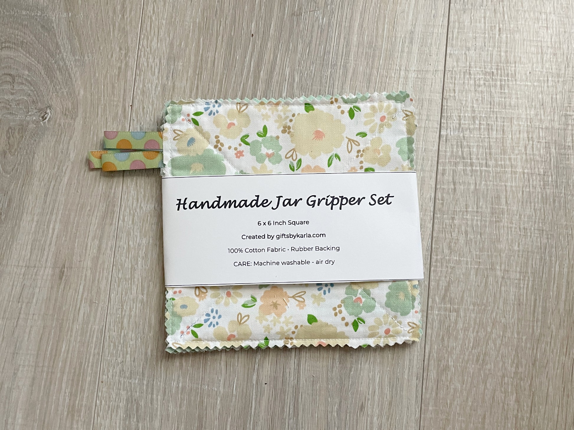 Green floral handmade fabric jar gripper set of three with non-slip backing and ribbon loops for opening stubborn jar lids