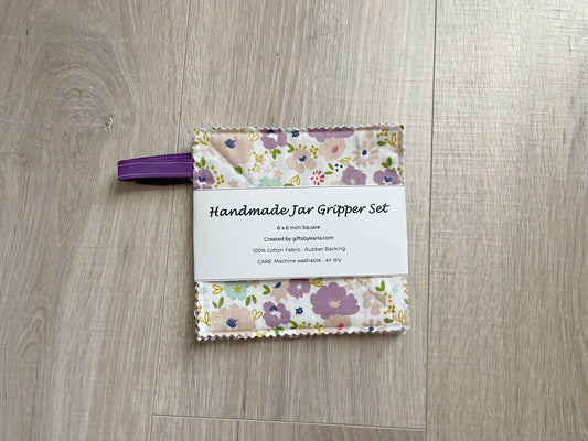 Purple floral handmade fabric jar gripper set of three with non-slip backing and ribbon loops for opening stubborn jar lids