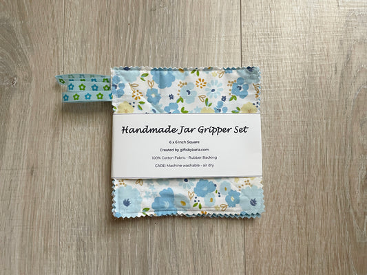 Blue floral handmade fabric jar gripper set of three with non-slip backing and ribbon loops for opening stubborn jar lids