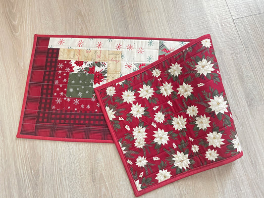 Quilted Christmas table runner with Log Cabin and Star blocks in red, white, and green