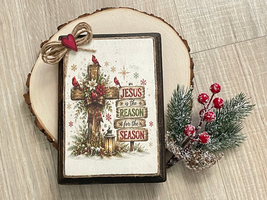 5×7 dark walnut Christmas plaque with cross, cardinals, greenery, and “Jesus Is the Reason for the Season” message.