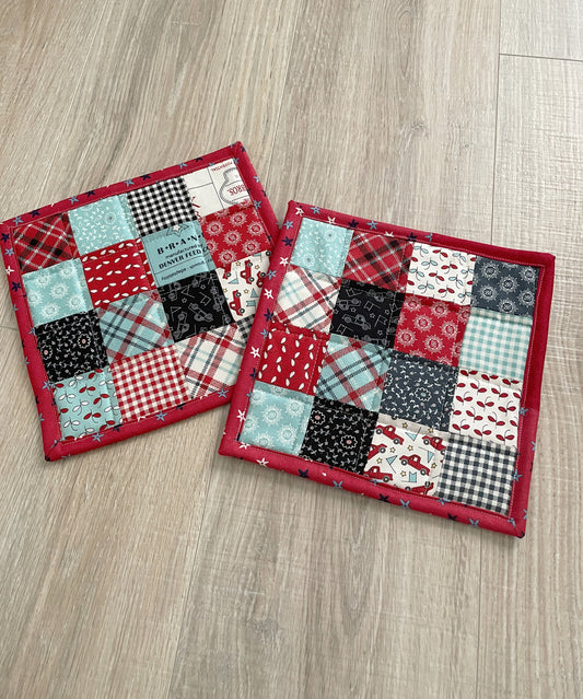 This set of 2 red, white, and blue patchwork potholders / hot pads will be a great addition to your country farmhouse kitchen décor.  Each finished hot pad/potholder is generously sized at 8.5 x 8.5 inches. 