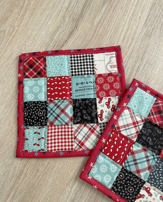 This set of 2 red, white, and blue patchwork potholders / hot pads will be a great addition to your country farmhouse kitchen décor.  Each finished hot pad/potholder is generously sized at 8.5 x 8.5 inches. 