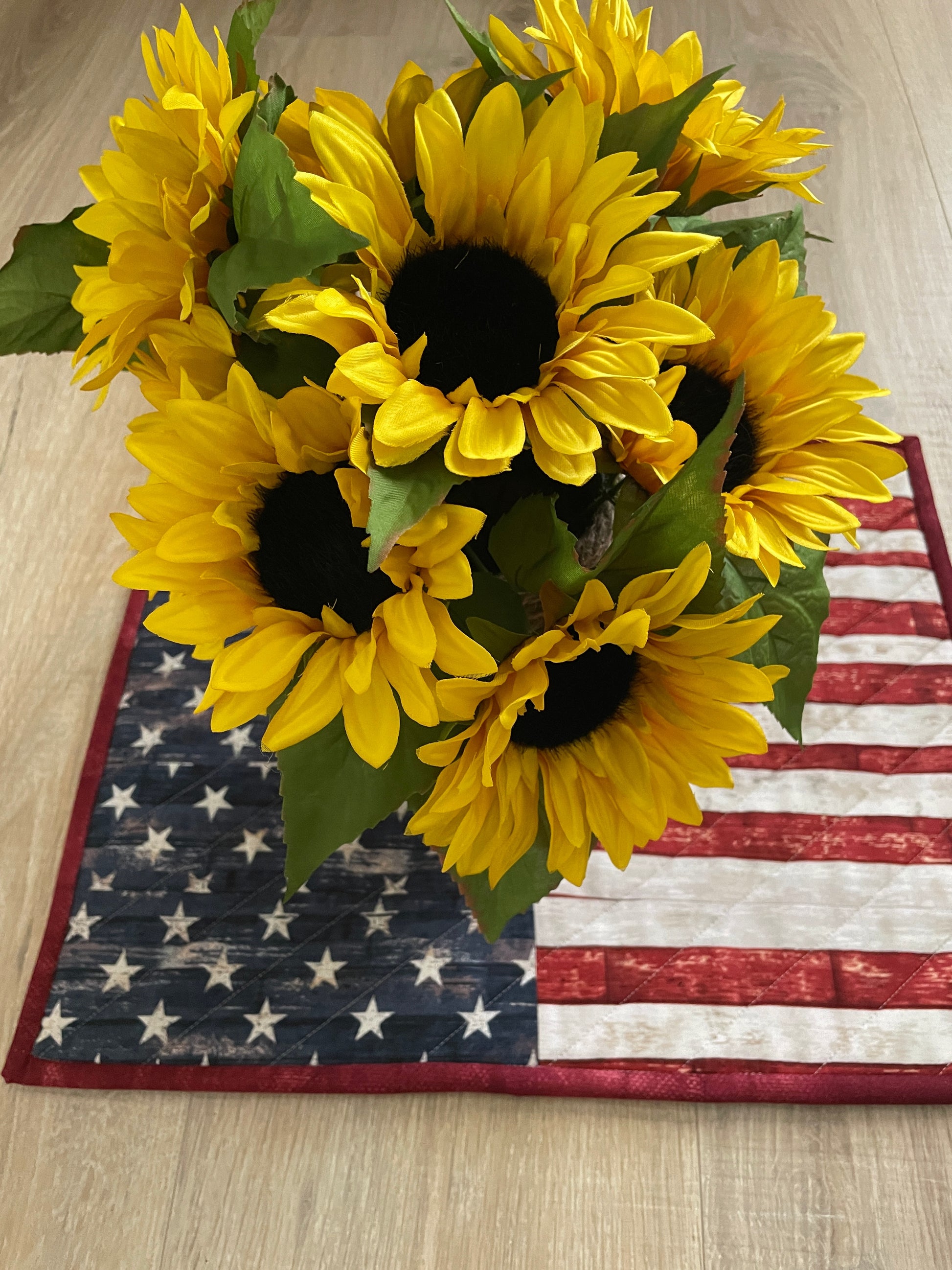 This lovely red, white, and blue quilted casserole hot pad makes your table beautiful! Measuring 13 x 16 inches, this handmade kitchen trivet features a scrappy improv patchwork resembling the American Flag, making it perfect for a 9 x 13 casserole dish or 2 smaller baking dishes.