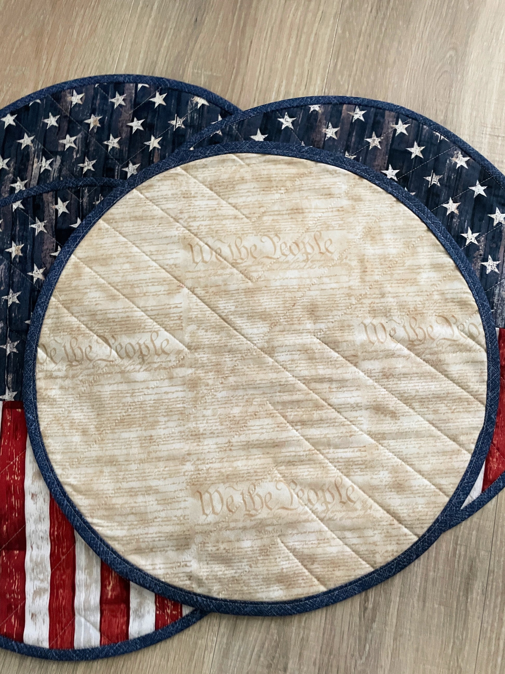 Time to celebrate America! Create a lovely table using these beautiful red, white, and blue round set of 4 rustic flag placemats, measuring 15 inches in diameter.