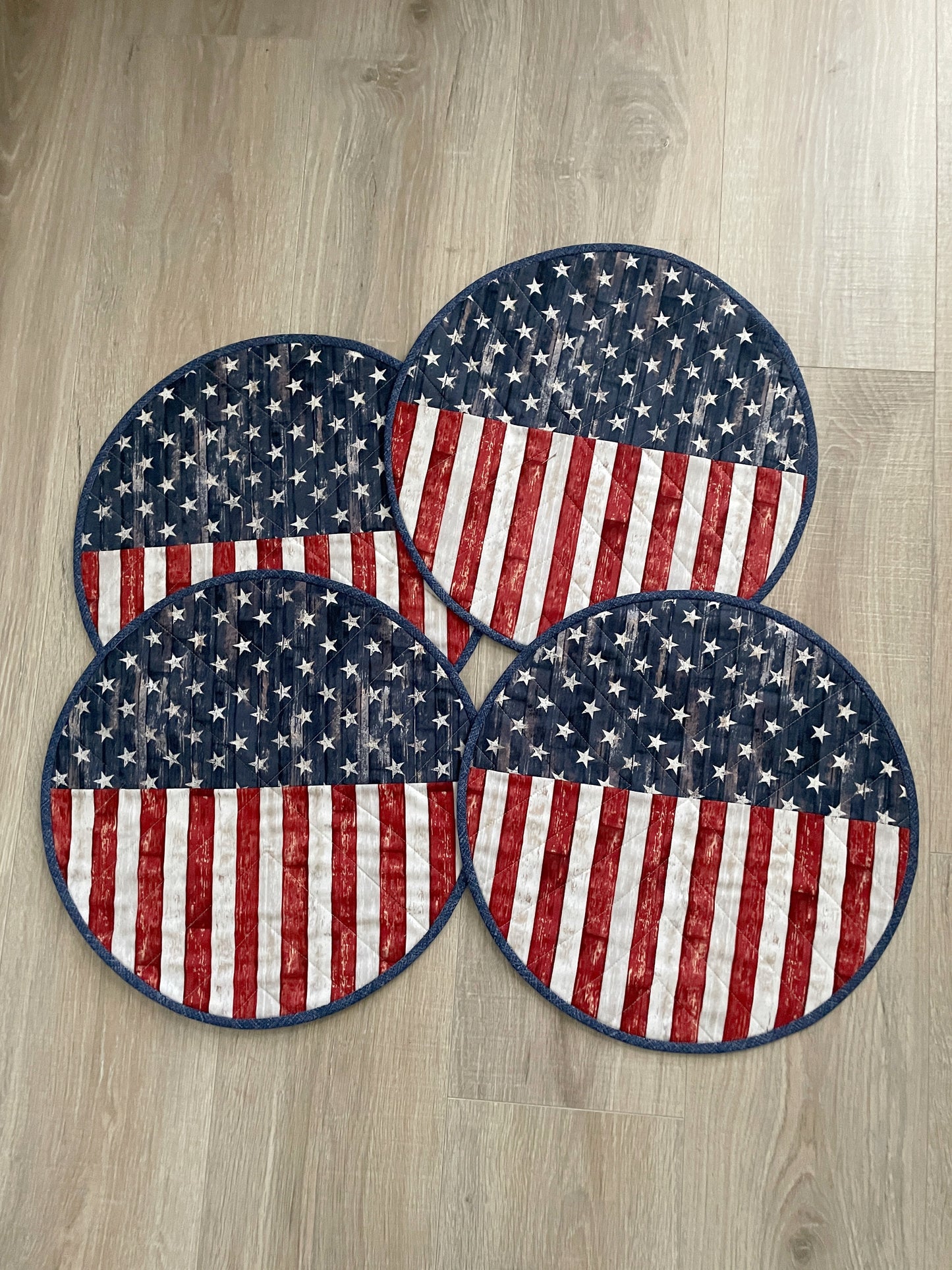 Time to celebrate America! Create a lovely table using these beautiful red, white, and blue round set of 4 rustic flag placemats, measuring 15 inches in diameter.