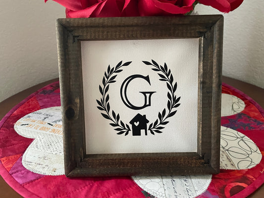 Rustic 6x6 wood framed family initial sign with canvas background and black farmhouse design.