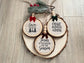 Set of three handcrafted nativity wood slice ornaments with hymn background, velvet bows,wooden beads, and jute hangers.